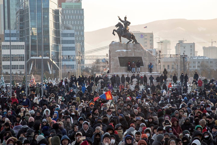 Protesters gather on Sukhbaatar Square in Ulaanbaatar in Mongolia on Monday, Dec. 5, 2022. Protesters angered by allegations of corruption linked to Mongolia's coal trade with China have stormed the State Palace in the capital, demanding dismissals of officials involved in the scandal. (AP Photo/Alexander Nikolskiy)