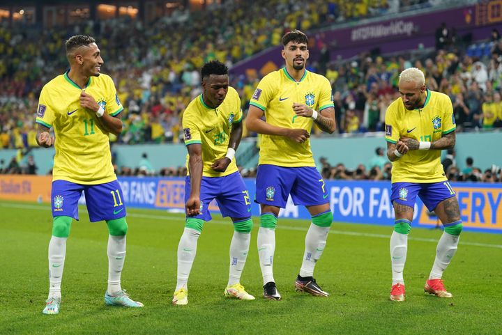 Brazil's players celebrating after scoring in their Monday match