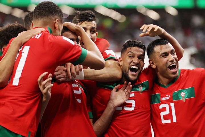 Morocco players celebrate after their win in the penalty shootout over Spain.