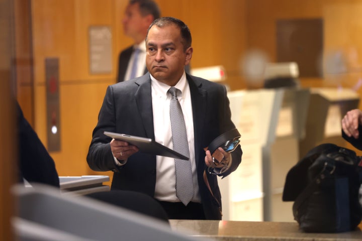 Former Theranos COO Ramesh "Sunny" Balwani goes through a security checkpoint during his first appearance in federal court for this case.