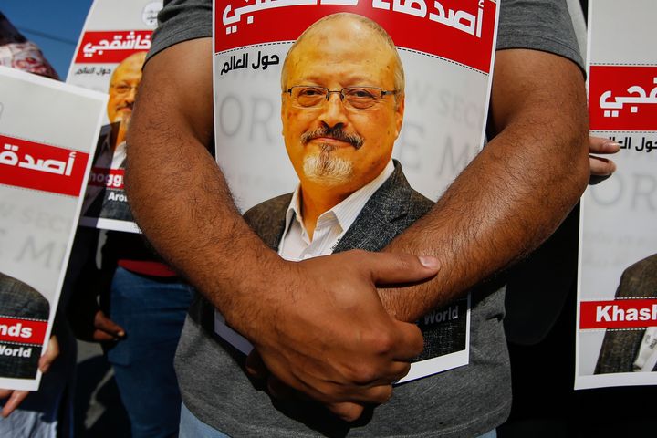 People hold posters of slain Saudi journalist Jamal Khashoggi, near the Saudi Arabia consulate in Istanbul, on Oct. 2, 2020. A federal judge dismissed a U.S. lawsuit against Saudi Crown Prince Mohammed bin Salman in the Saudi killing of U.S.-based journalist Jamal Khashoggi on Tuesday, bowing to the Biden administration's insistence that the prince was legally immune in the case.