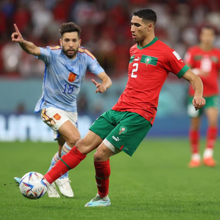 Achraf Hakimi of Morocco (front) during the FIFA World Cup Qatar 2022 Round of 16 match between Morocco and Spain at Education City Stadium on Dec. 6 in Al Rayyan, Qatar.