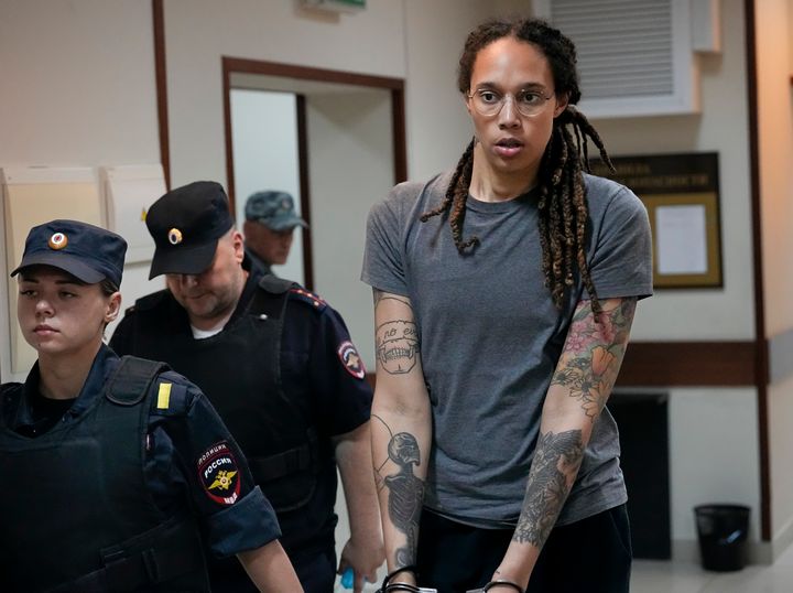 WNBA star and two-time Olympic gold medalist Brittney Griner is escorted from a courtroom after a hearing outside Moscow on Aug. 4, 2022.