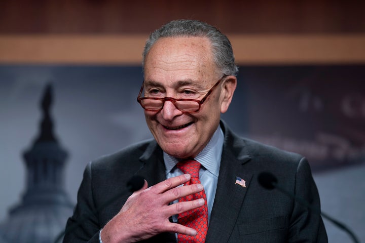 Senate Majority Leader Chuck Schumer, D-N.Y., speaks with reporters after Democratic Sen. Raphael Warnock defeated Republican challenger Herschel Walker in a runoff election in Georgia last night, at the Capitol in Washington, on Dec. 7, 2022.