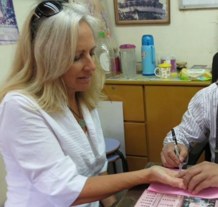 The author with the fortuneteller who told her in 2013 that she would live to be 80.