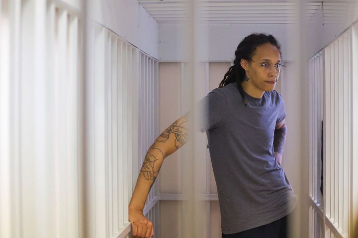 WNBA star Brittney Griner waits for the verdict inside a defendants' cage during a hearing in Khimki outside Moscow on Aug. 4.