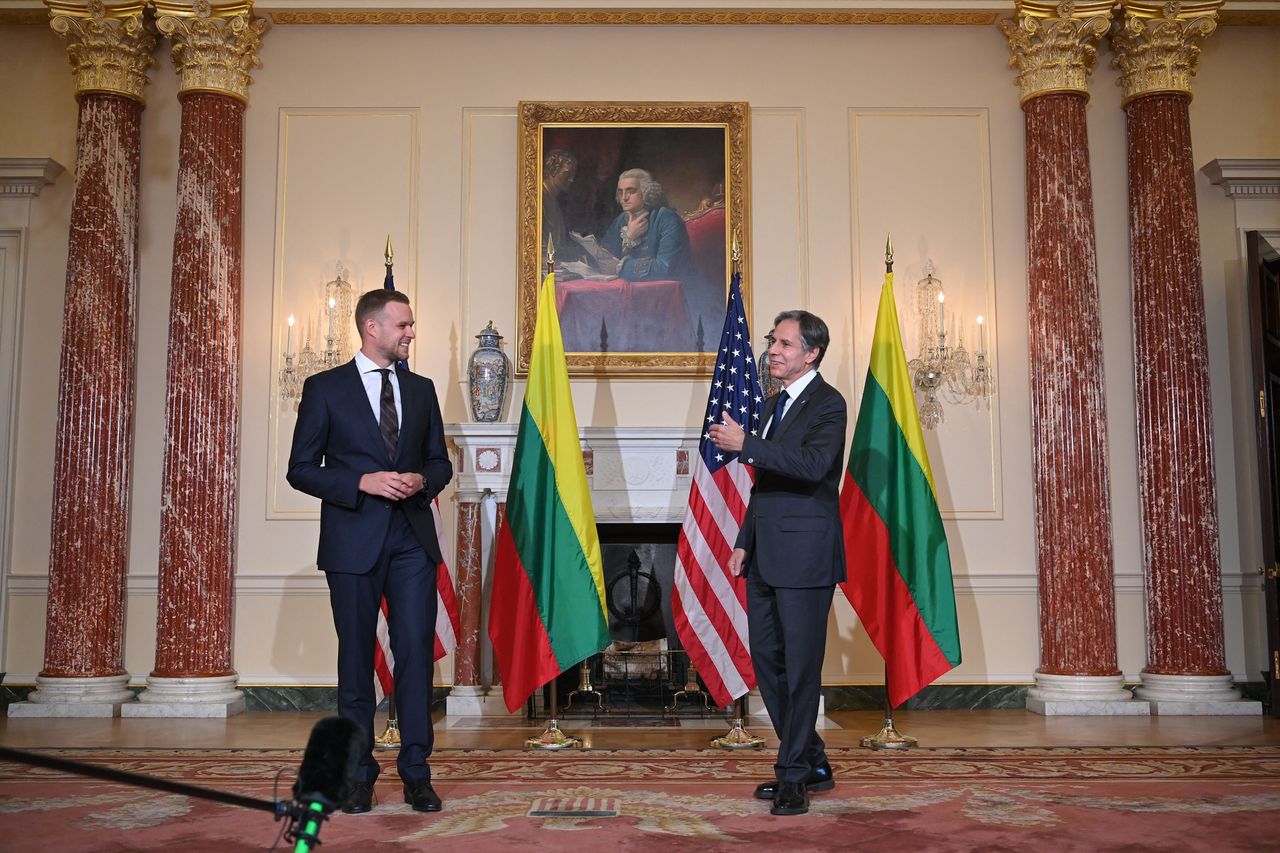 U.S. Secretary of State Antony Blinken (R) poses with Lithuania's Foreign Minister Gabrielius Landsbergis in the Benjamin Franklin Room of the State Department ahead of a meeting in Washington, D.C., on Sept. 15, 2021.