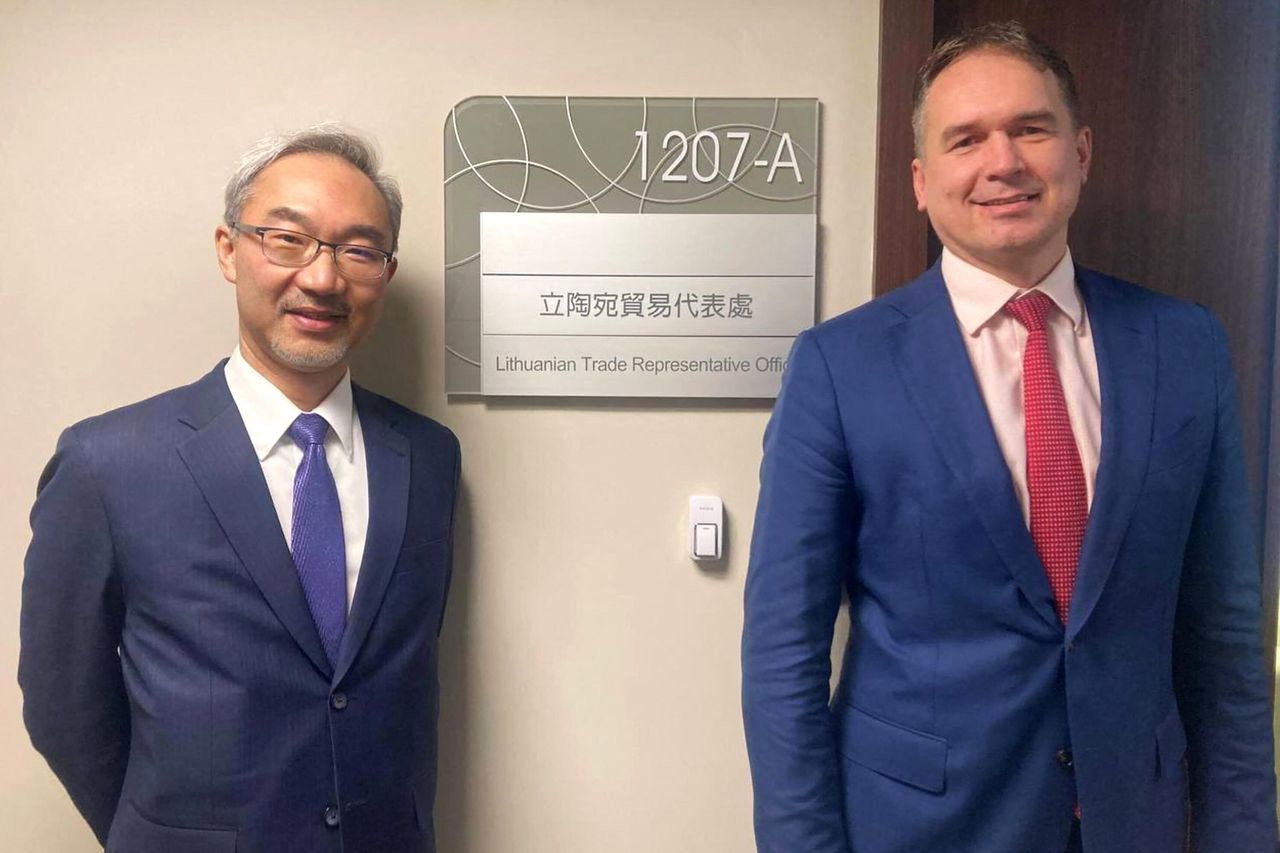 Lithuania opened its office in Taiwan, where a Lithuanian and a Taiwanese official are pictured here, nearly one year after the Taiwanese office opened in Vilnius.