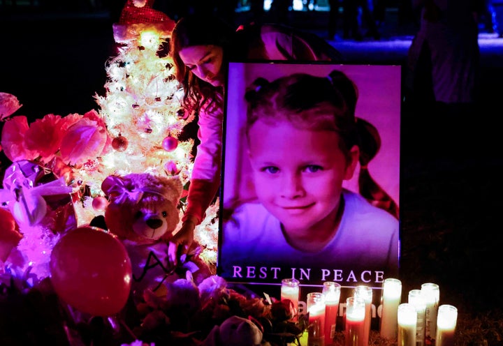 Attendees offer their respect to a makeshift memorial for late Athena Strand after a memorial service at First Baptist Church of Cottondale in Paradise, Texas, on Tuesday, Dec. 6, 2022. Strand went missing from her home in Wise County last week and her body was found Friday evening. (Shafkat Anowar/The Dallas Morning News via AP)