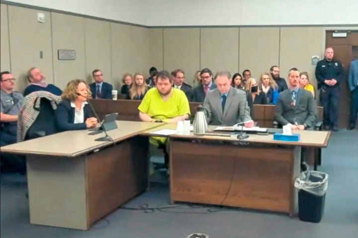 Anderson Lee Aldrich, 22, center, sits during a court appearance in Colorado Springs, Colo. on Tuesday.