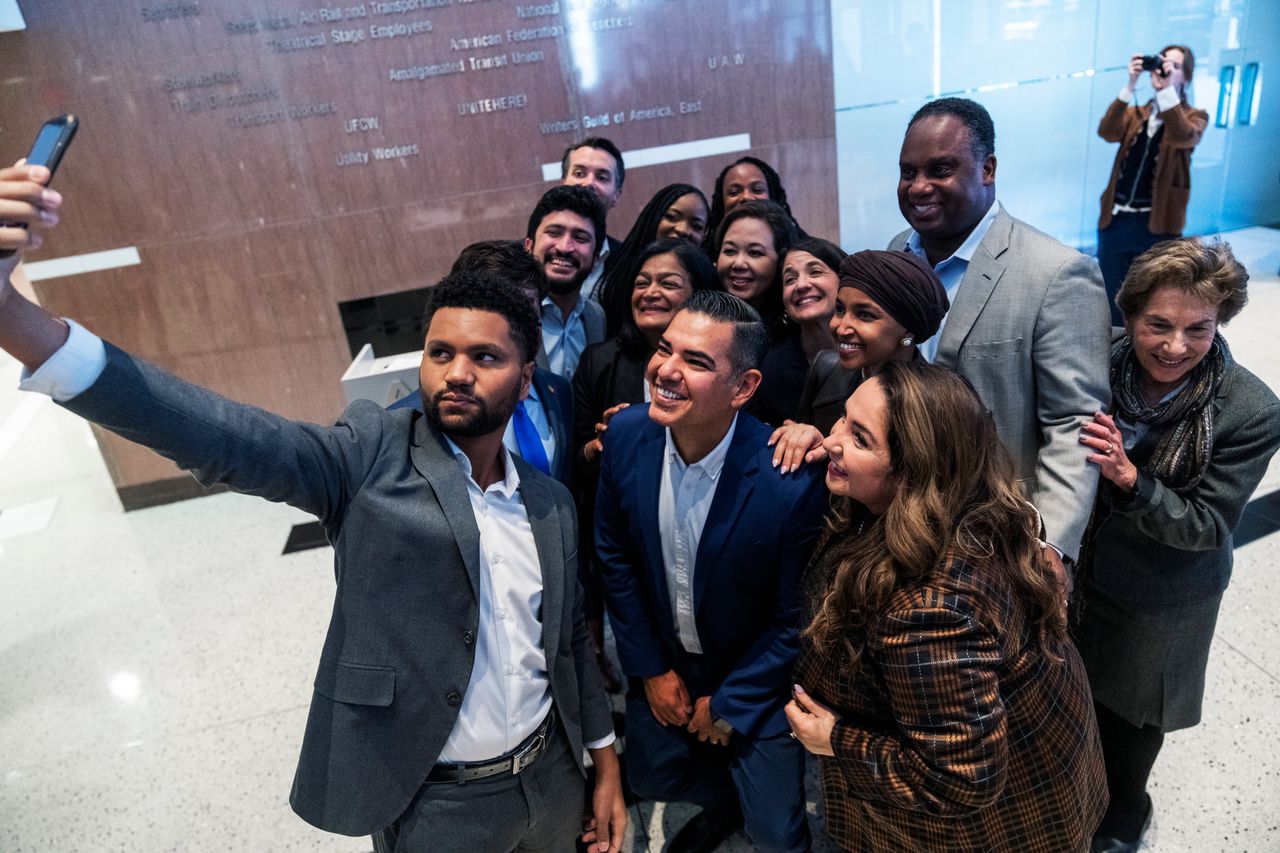 Maxwell Frost takes a selfie with members of the Congressional Progressive Caucus at the U.S. Capitol.