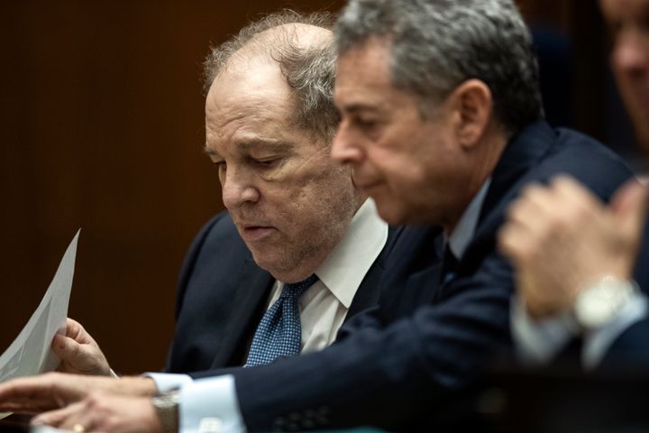 LOS ANGELES, CA - OCTOBER 04: Former film producer Harvey Weinstein (L) interacts with his attorney Mark Werksman in court at the Clara Shortridge Foltz Criminal Justice Center on October 4, 2022 in Los Angeles, California. Harvey Weinstein was extradited from New York to Los Angeles to face sex-related charges. (Photo by Etienne Laurent-Pool/Getty Images)