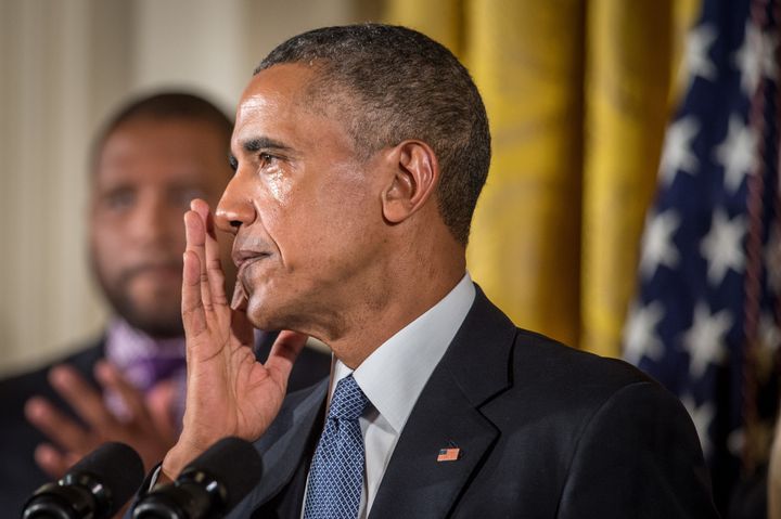 Obama wipes away tears as he talks about needless shootings at Sandy Hook Elementary school during a press briefing in the East Room of the White House Jan. 5, 2016 in Washington, D.C. 