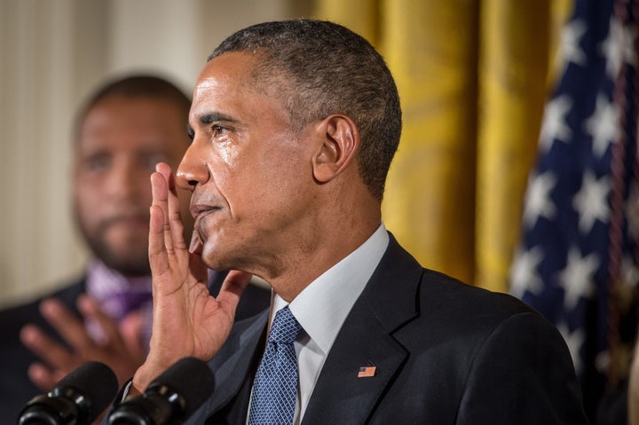 Obama wipes away tears as he talks about needless shootings at Sandy Hook Elementary school during a press briefing in the East Room of the White House Jan. 5, 2016 in Washington, D.C.