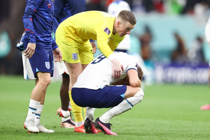 AL KHOR, QATAR - DECEMBER 10: A dejected Harry Kane of England reacts at full time with Jordan Pickford of England after his team is knocked out of the FIFA World Cup during the FIFA World Cup Qatar 2022 quarter final match between England and France at Al Bayt Stadium on December 10, 2022 in Al Khor, Qatar. (Photo by James Williamson - AMA/Getty Images)