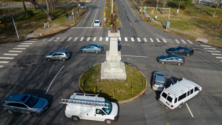 Traffic drives in the circle around the monument of Confederate General A.P. Hill, which contains his remains, in Richmond, Virginia.