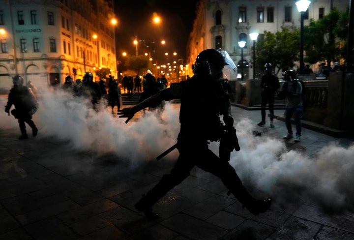 Tear gas is returned to police trying to break up supporters of ousted President Pedro Castillo at plaza San Martin in Lima, Peru, on Dec. 11, 2022.