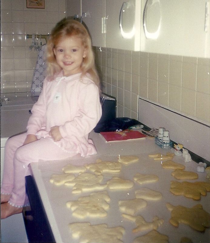 The author at 2 years old in 1992. “I'm sitting next to that year’s batch of our annual Christmas cookies,” she writes. “A the time, we were living on the same military base in Okinawa, Japan, that we came back to just before I entered high school.”
