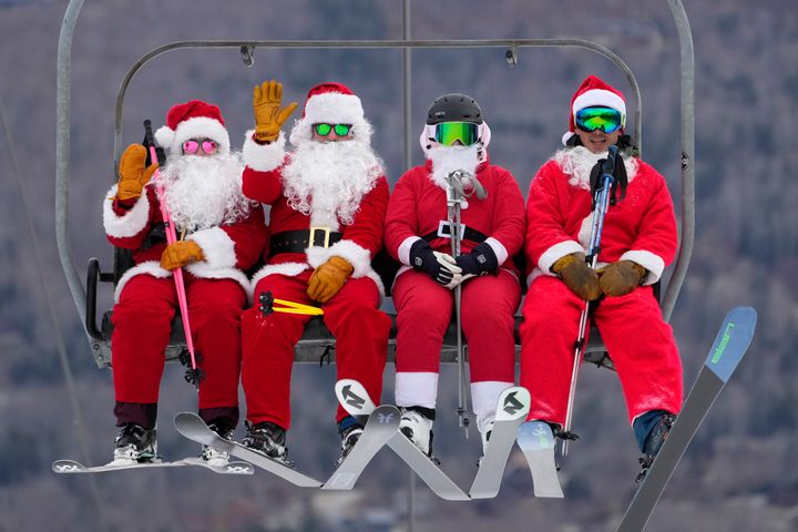 Skiers dressed in Santa (AP Photo/Robert F. Bukaty)