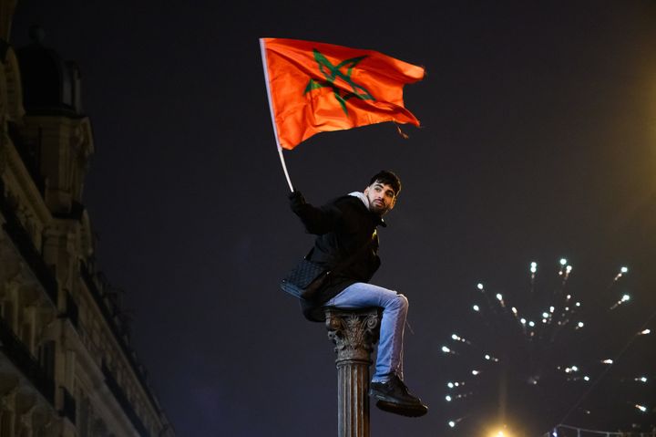 Moroccan fans celebrate in Champs Elysees after Moroccan football team beat Portugal in 2022 FIFA World Cup at Qatar in Paris, France on December 10, 2022.