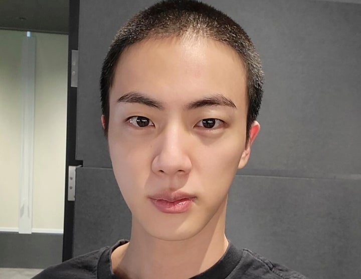 Jin of K-pop band BTS shows off freshly shaved hair ahead of his upcoming military conscription.
