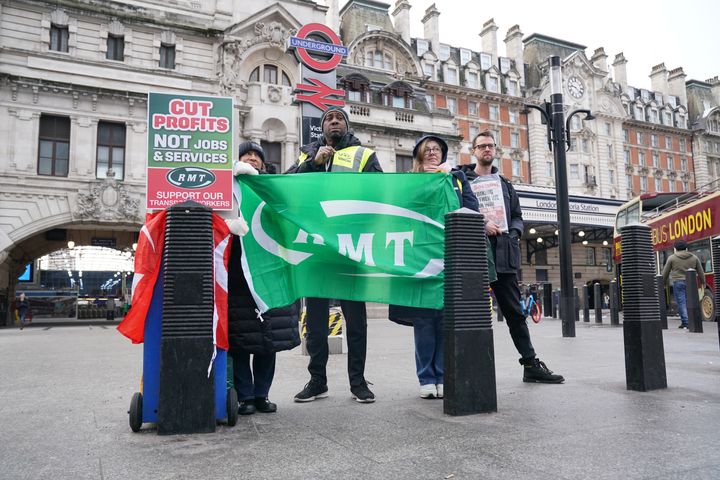 RMT members stand on the picket line outside Victoria station in central London this morning.