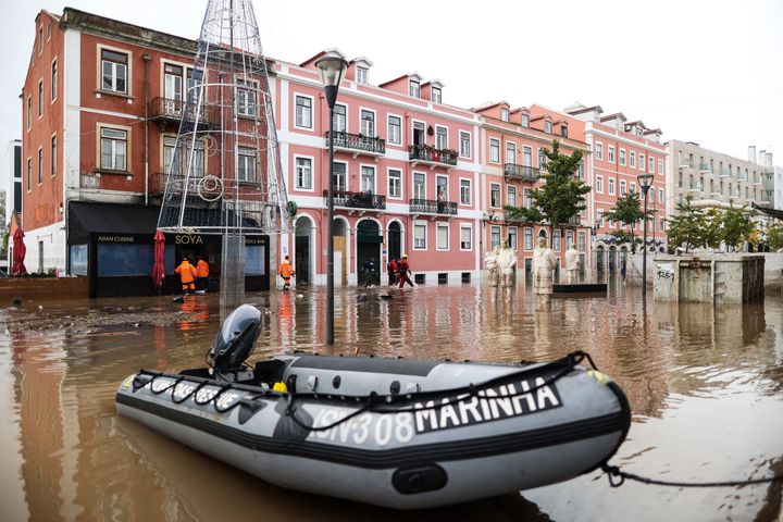 Fire fighters and rescuers check homes and businesses following heavy rains in Lisbon on December 13, 2022. (Photo by FILIPE AMORIM / AFP) (Photo by FILIPE AMORIM/AFP via Getty Images)