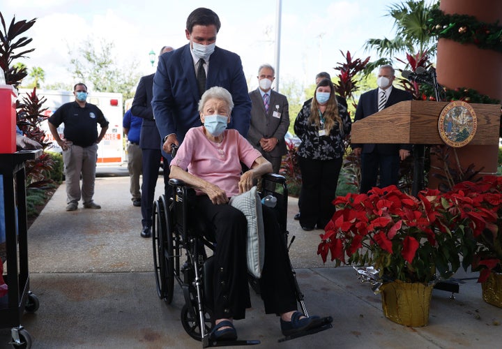 Florida Gov. Ron DeSantis pushes Vera Leip, 88, in her wheelchair after she received a Pfizer-BioNtech COVID-19 vaccine at the John Knox Village Continuing Care Retirement Community on Dec. 16, 2020 in Pompano Beach, Florida. The facility, one of the first in the country to do so, vaccinated approximately 170 people including healthcare workers and elder care people.