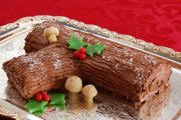 Marzipan mushrooms add to the festive accoutrements on this yule log cake.