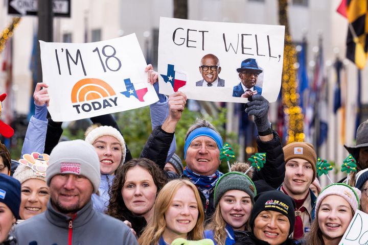 A "Today" show fan holds up a "get well" sign for Al Roker on Nov. 22.