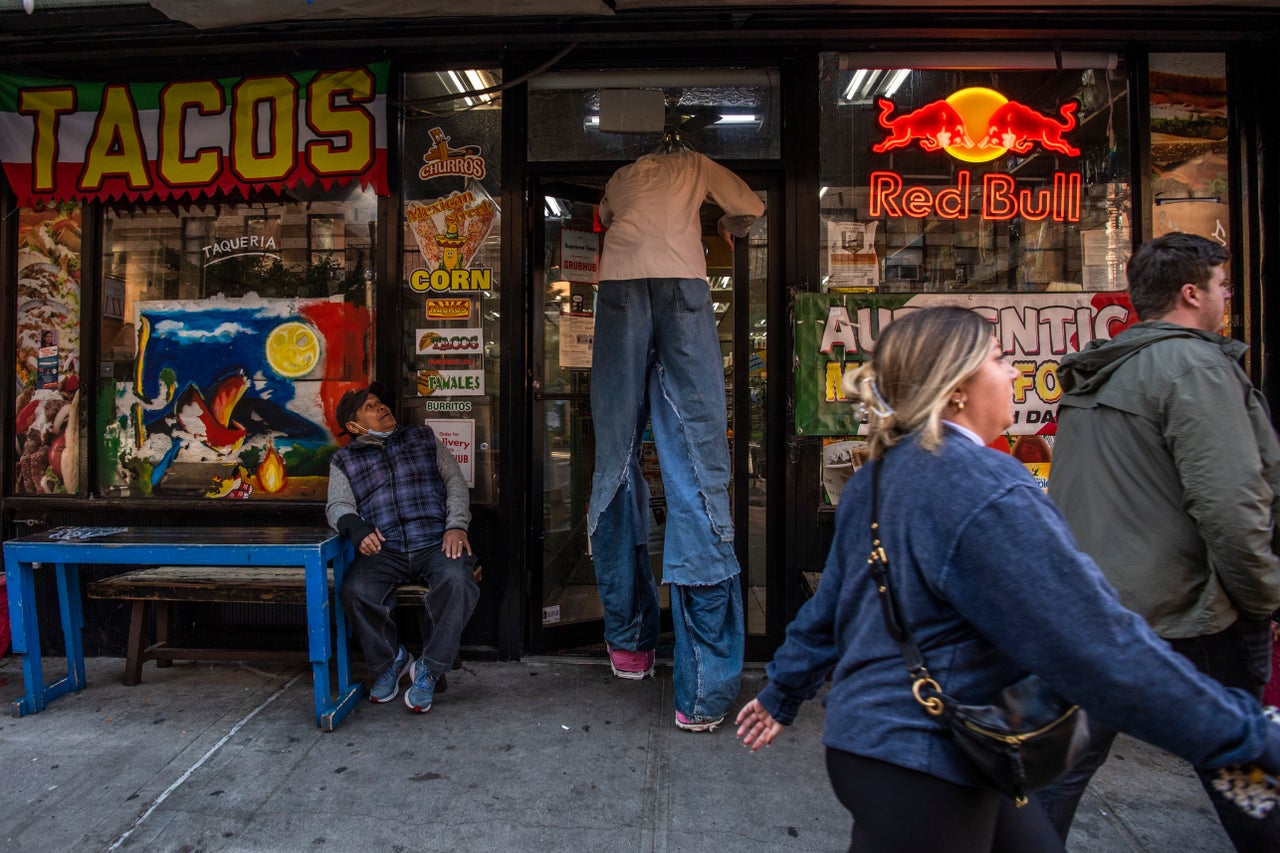 Bobby walks inside his favorite deli, Ben's Deli and Grocery store, in the East Village.