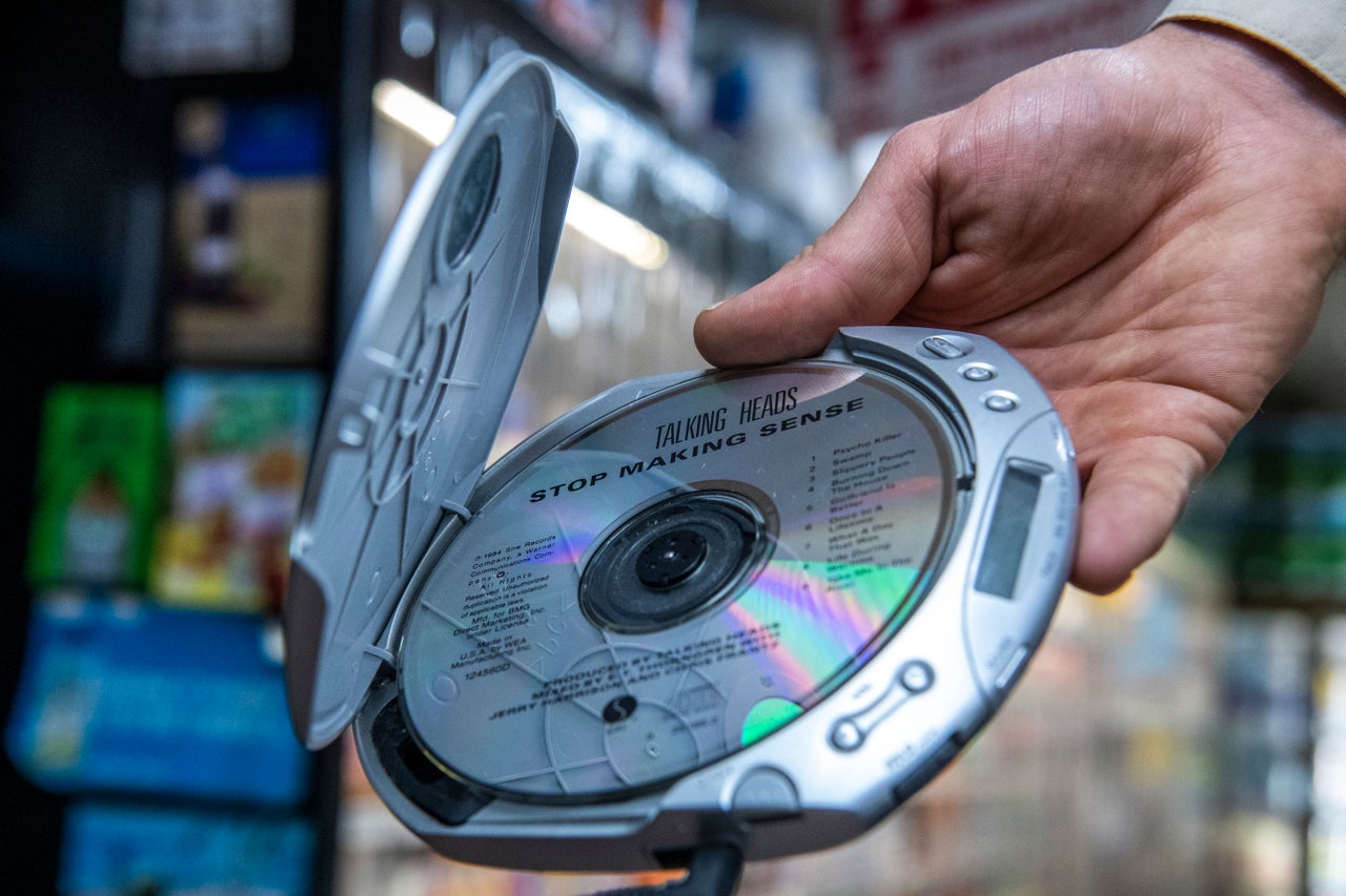 Bobby listens to music on a CD player as he walks around New York.