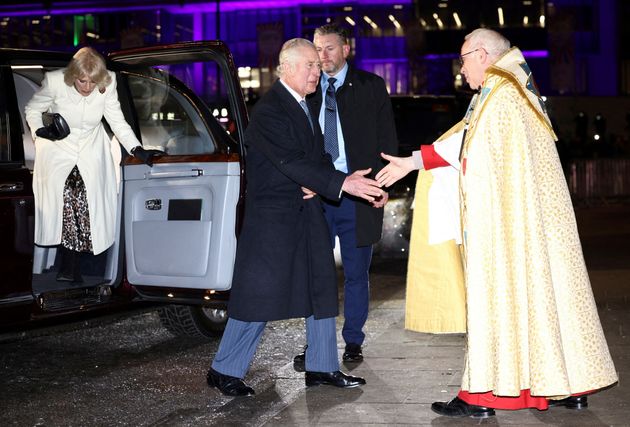 King Charles is welcomed by Dean of Westminster David Hoyle upon his arrival with Camilla, Queen Consort.