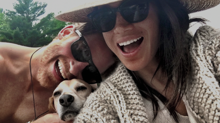 A private photograph of Prince Harry and Meghan, the Duke and Duchess of Sussex, and their dog, featured in their Netflix docuseries "Harry & Meghan."