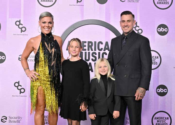 Pink (left) poses with her two children, Willow Sage Hart and Jameson Moon Hart, alongside husband Carey Hart.