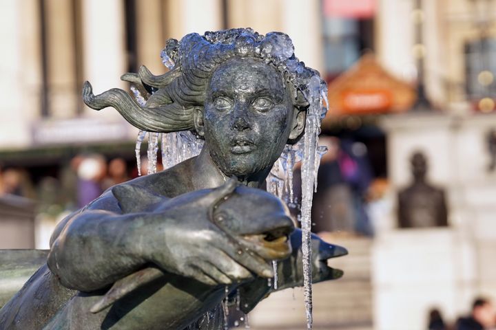 A frozen fountain in Trafalgar Square, central London. Snow and ice have swept across parts of the UK, with cold wintry conditions set to continue for days. Picture date: Friday December 16, 2022.