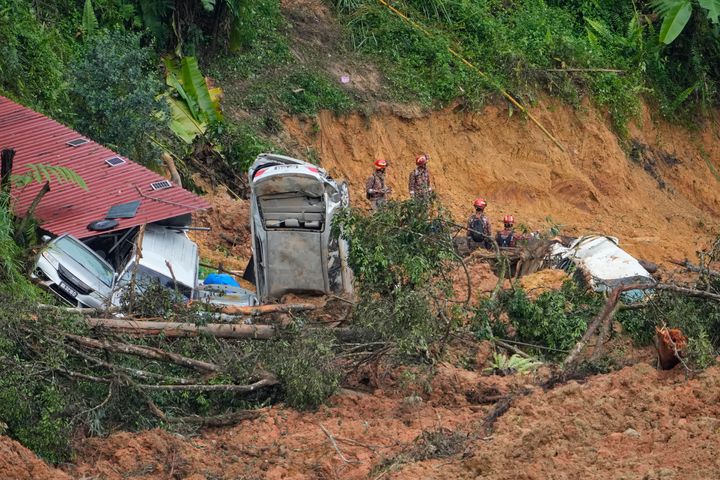 Rescue teams continue searching for victims of a landslide in Batang Kali, Malaysia on Saturday.