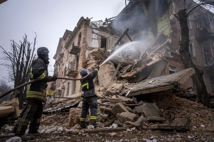 Ukrainian State Emergency Service firefighters work to extinguish a fire at a building in Kryvyi Rih on Dec. 16.