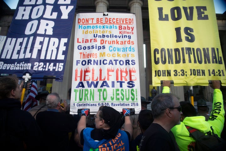 FILE - Attendees congregate at a rally against gender-affirming care at War Memorial Plaza in Nashville, Tenn., Oct. 21, 2022. Hate speech and threats of violence targeting transgender people and other LGBTQ individuals is thriving on social media and spurring fears of more violence. (Nicole Hester/The Tennessean via AP)