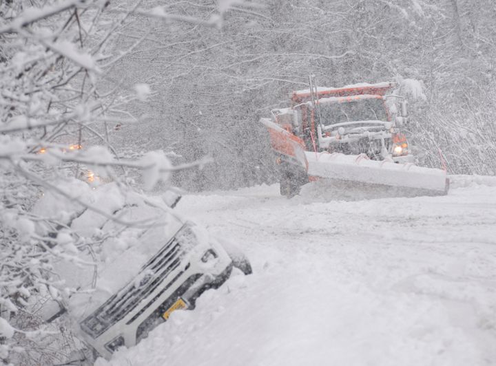 A state plow truck clears the snow along Route 30 in Jamaica, Vt., during a snowstorm on Friday, Dec. 16, 2022. (Kristopher Radder/The Brattleboro Reformer via AP)