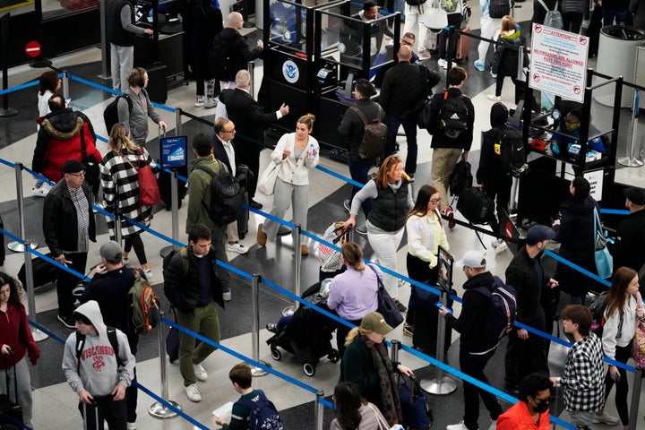 FILE - A sign warns travelers not to bring guns through the Transportation Security Administration checkpoint at O'Hare International Airport in Chicago, Nov. 23, 2022. The federal agency tasked with screening passengers before they get on planes says officers this year have stopped a record number of guns brought by passengers attempting to go through airport security checkpoints. (AP Photo/Nam Y. Huh)