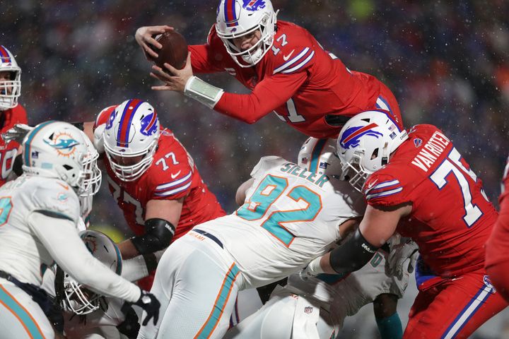 Buffalo Bills quarterback Josh Allen (17) dives for a two-point conversion during the second half of an NFL football game against the Miami Dolphins in Orchard Park, New York on Saturday.