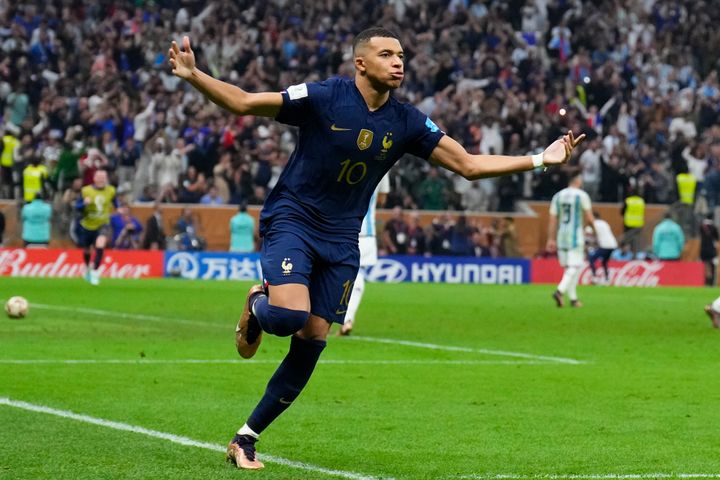 France's Kylian Mbappe celebrates after scoring his side's third goal during the World Cup final soccer match.