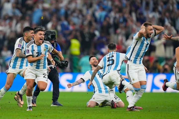 Argentinian players celebrate after winning the penalty shootout.