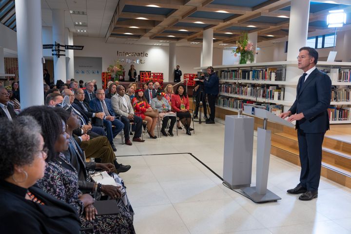 Dutch Prime Minister Mark Rutte, right, apologized on behalf of his government for the Netherlands' historical role in slavery and the slave trade at the National Archives in The Hague, on Dec. 19, 2022. 
