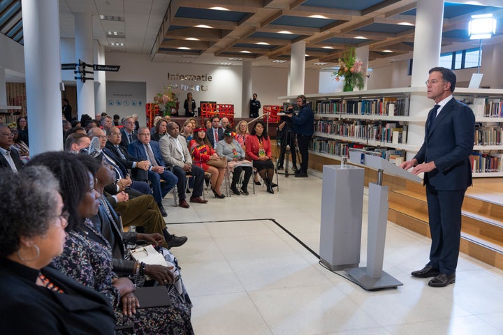 Dutch Prime Minister Mark Rutte, right, apologized on behalf of his government for the Netherlands' historical role in slavery and the slave trade at the National Archives in The Hague, on Dec. 19, 2022.