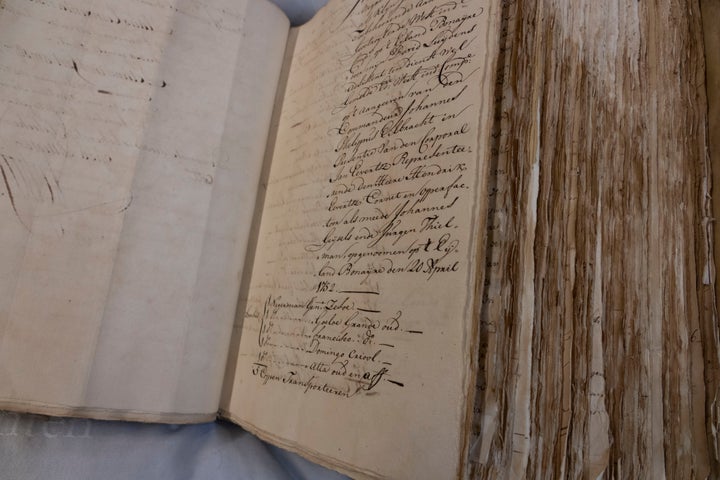 A ledger containing the names of enslaved people is shown at the National Archives in The Hague, Netherlands, on Dec. 19, 2022. The Dutch government is expected to issue a long-awaited formal apology for its role in the slave trade, with a speech by Dutch Prime Minister Mark Rutte, and ceremonies in the former colonies.