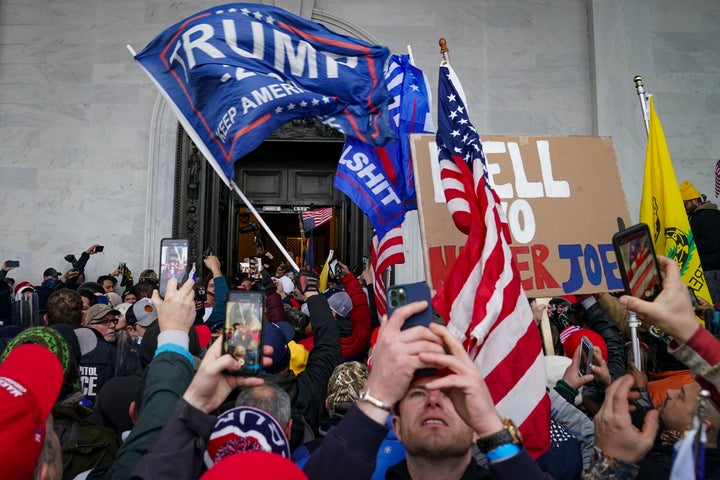 Supporters of President Donald Trump riot outside the Capitol on Jan. 6, 2021.