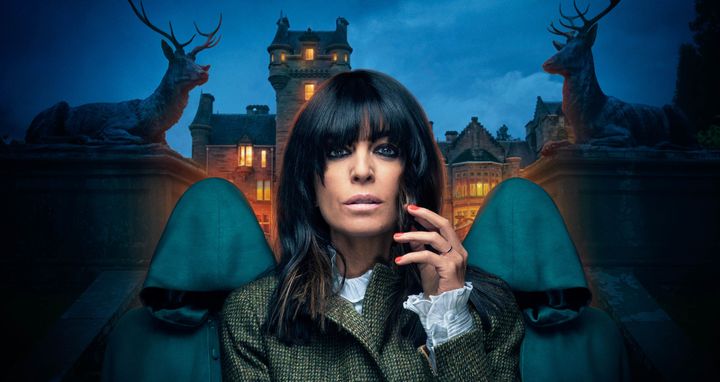 Claudia Winkleman strikes a dramatic pose outside the Traitors castle