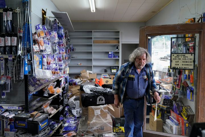 Kenny Ransbottom walks through debris inside his auto parts store after an earthquake in Rio Dell, Calif., Tuesday, Dec. 20, 2022. A strong earthquake shook a rural stretch of Northern California early Tuesday, jolting residents awake, cutting off power to 70,000 people, and damaging some buildings and a roadway, officials said. (AP Photo/Godofredo A. Vásquez)